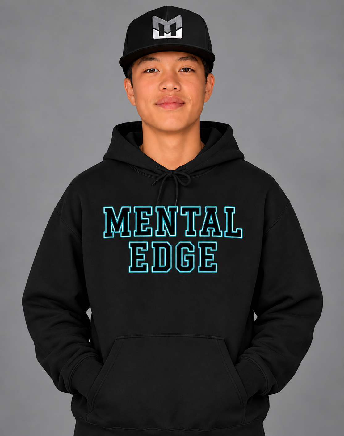 Mental Edge Teal Varsity Hoodie in black, worn by a young athlete