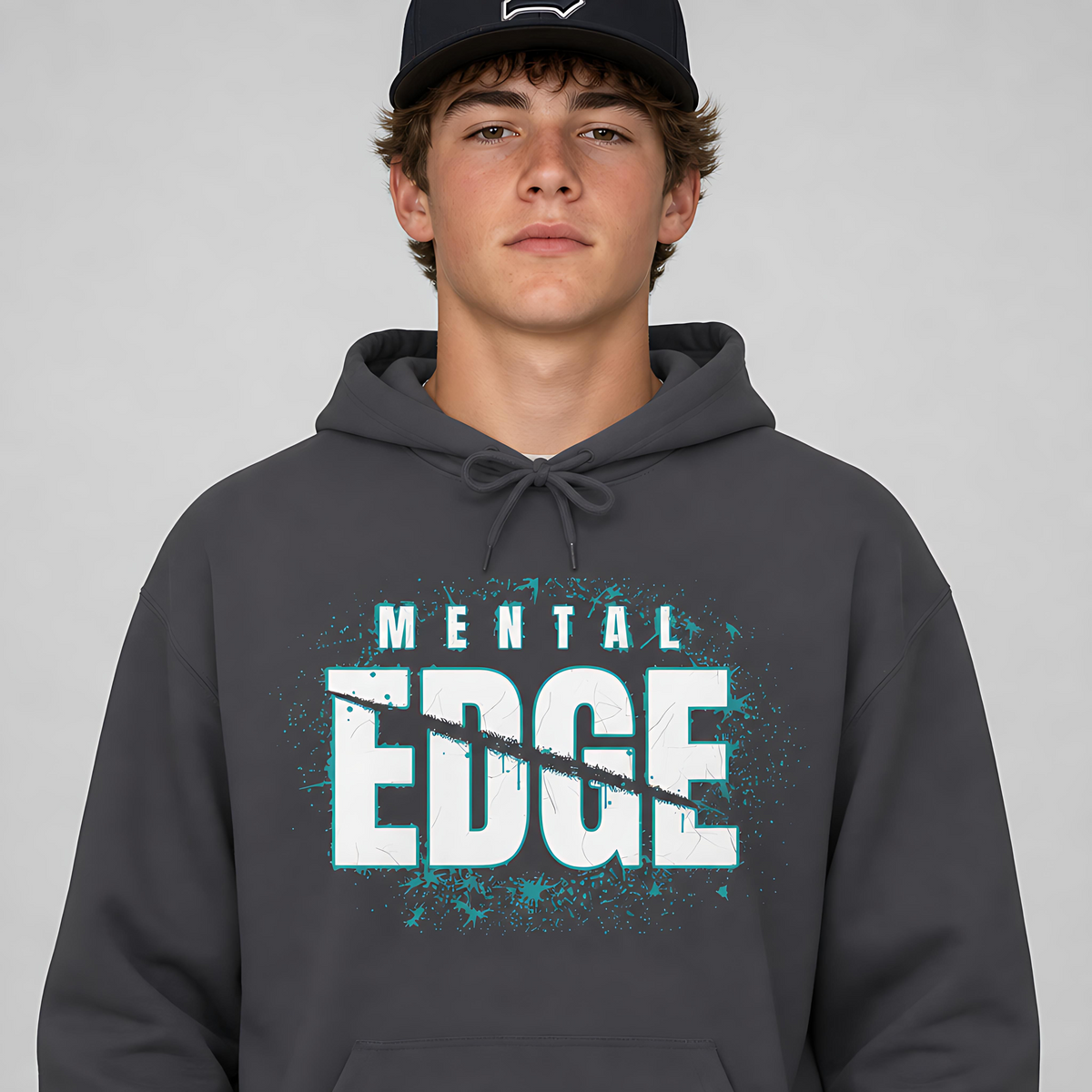 Baseball player wearing the charcoal Mental Edge Loud Splatter Hoodie