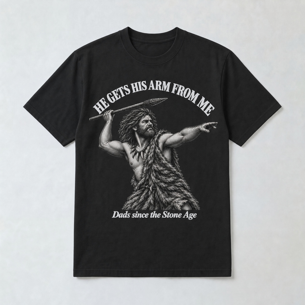 He Gets His Arm From Me Caveman Adult T-Shirt — "Dads since the Stone Age"